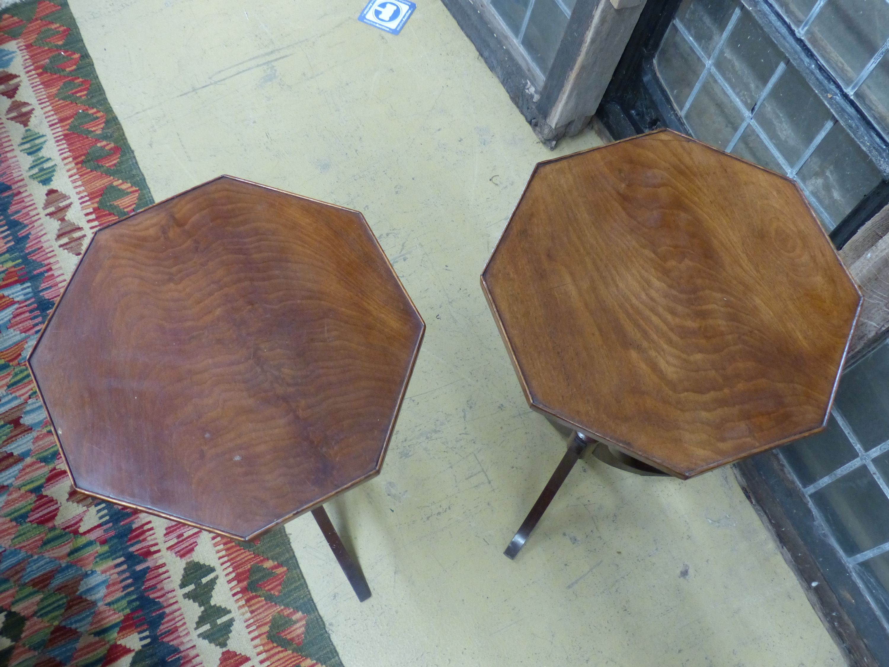A pair of Regency style mahogany octagonal wine tables